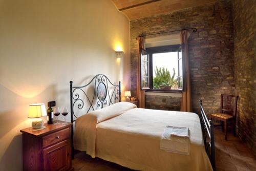 Ένα ή περισσότερα κρεβάτια σε δωμάτιο στο Agriturismo Bellarosa