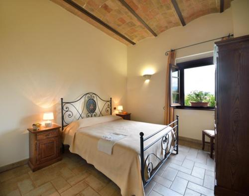 Ένα ή περισσότερα κρεβάτια σε δωμάτιο στο Agriturismo Bellarosa