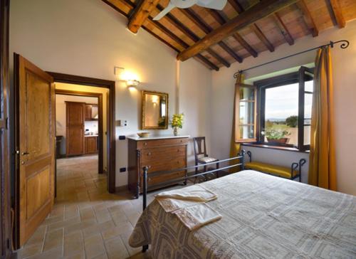 Ένα ή περισσότερα κρεβάτια σε δωμάτιο στο Agriturismo Bellarosa