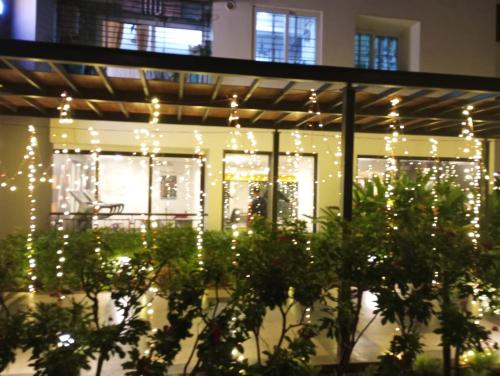 a lit up building with christmas lights at Ranga Vila’s on ECR in Chennai