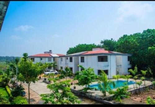 an aerial view of a resort with a swimming pool at Hotel Ecotel in Nagaon