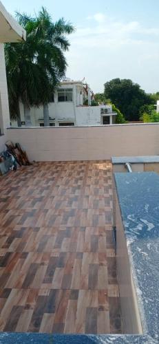 a view from the roof of a house with a wooden floor at Sindu Villa in Lucknow