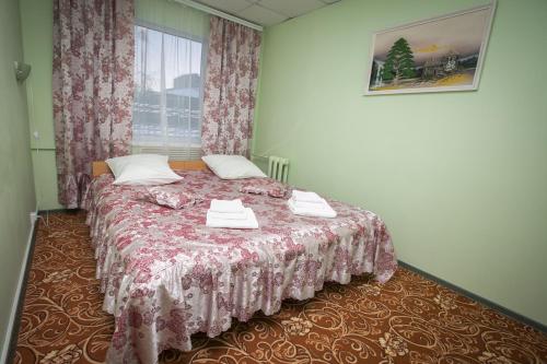 Кровать или кровати в номере Гостиница "Гармония Плюс"
