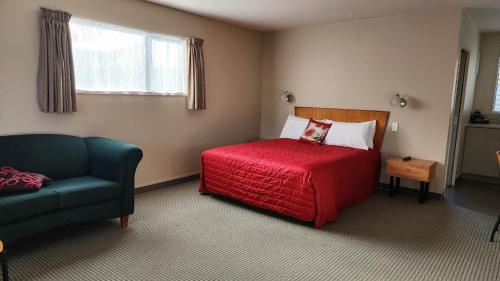 A bed or beds in a room at Ashburton's Regency Motel