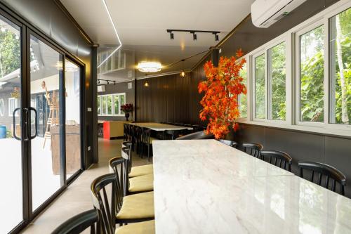 a conference room with a large marble table and chairs at Halo Retreat in Hòa Bình