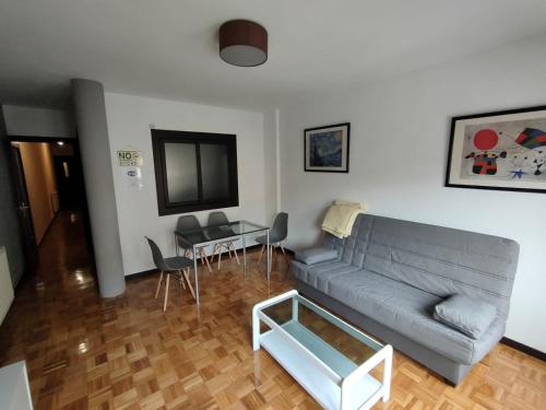a living room with a couch and a table at CASA DANIELA APARTAMENTOS-The pilgrim's house apartments in Estella