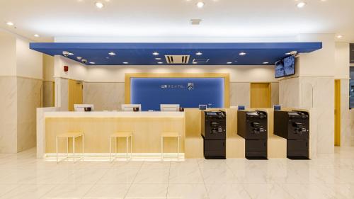 a store with a row of ice chests in a lobby at Toyoko Inn Osaka Namba in Osaka