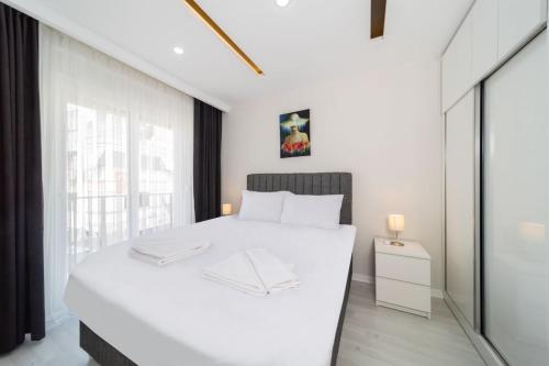 Postel nebo postele na pokoji v ubytování Lovely Apartment with Central Location Walking Distance to Beach in Muratpasa, Antalya