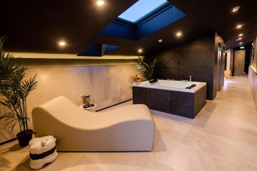 a bathroom with a bath tub and a sink at Black Hotel in Rome