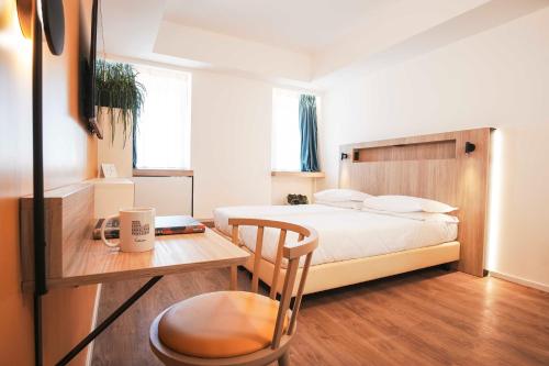 Postel nebo postele na pokoji v ubytování Aparthotel Colombo Roma