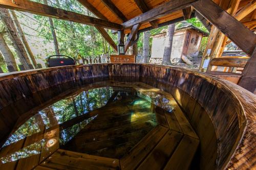 an overhead view of a wooden spiral staircase in a cabin at Forest Home Relax in Borzont