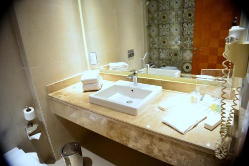 a bathroom with a sink and a mirror at Royal Club 24 Hours All Inclusive - Marina Sharm in Sharm El Sheikh