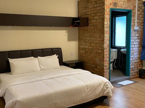 Postel nebo postele na pokoji v ubytování GOPENG INN Homestay