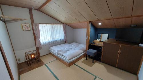 Postel nebo postele na pokoji v ubytování Lodge Hahnenkamm