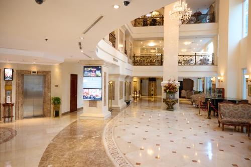 a lobby of a hotel with candles on the floor at Hotel Grand Saigon in Ho Chi Minh City