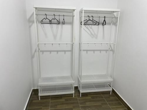 a white refrigerator with two empty shelves at Elegant Garden-view 1BR in New Cairo in Cairo