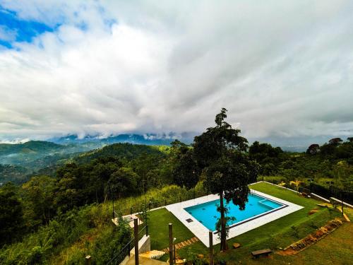 an image of a swimming pool on top of a hill at The Aurelia in Gampola