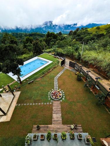 an aerial view of a garden with a swimming pool at The Aurelia in Gampola
