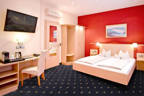 Postel nebo postele na pokoji v ubytování Hotel Goldene Rose