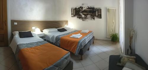 Postel nebo postele na pokoji v ubytování Bed & Bar Mini Apartment