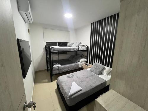 Postel nebo postele na pokoji v ubytování Hermoso apartamento para descansar en familia