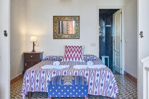 a bedroom with a bed and a chair at Finca Tanca in Calonge