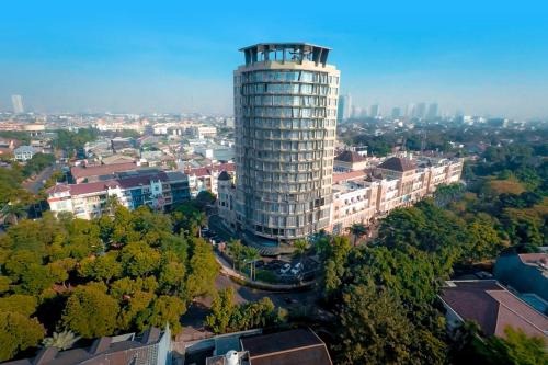 an overhead view of a tall building in a city at THE 1O1 Jakarta Sedayu Darmawangsa in Jakarta