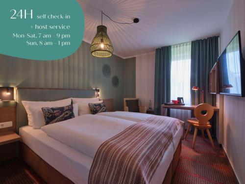Postel nebo postele na pokoji v ubytování Classik Hotel Martinshof, Messe München