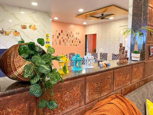 a kitchen with a counter with a plant on it at Elsewhere Villa by Hill Staytion in Mahabaleshwar