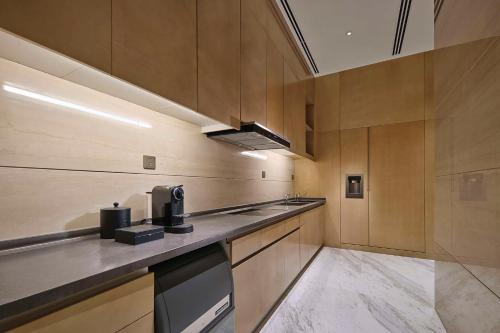 a kitchen with wooden walls and a counter top at Hilton Beijing Tongzhou in Beijing