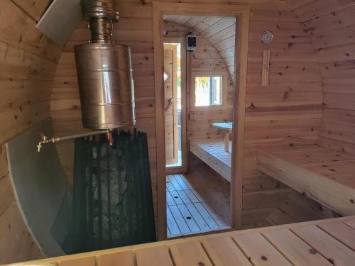 a view of a wooden cabin with a shower in it at Chata U dědka in Prostřední Bečva