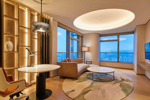 a living room with a couch and a table at The Westin Wenzhou in Wenzhou