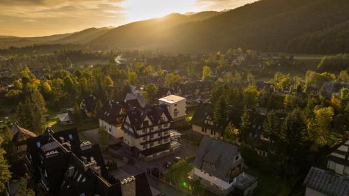 an aerial view of a town with buildings and trees at My Tatra Residence in Zakopane