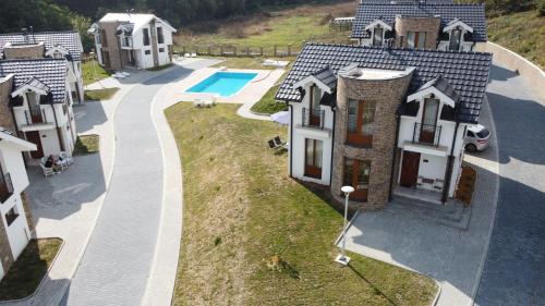 an aerial view of a house with a swimming pool at Royal King in Vrnjačka Banja