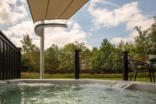 a swimming pool with a water fountain at Woodcock in Selby