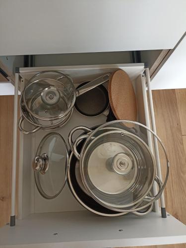 a bunch of pots and pans in a drawer at Apart ban Voltas in Umhausen