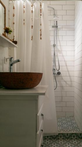 a bathroom with a wooden sink and a shower at Masal Evimiz in Antalya