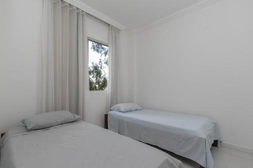 A bed or beds in a room at Apartamento 2 quartos no Buritis