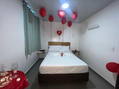 מיטה או מיטות בחדר ב-Hotel Olam Confort