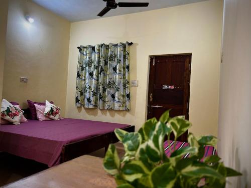 Postel nebo postele na pokoji v ubytování Anjunapalms GuestHouse