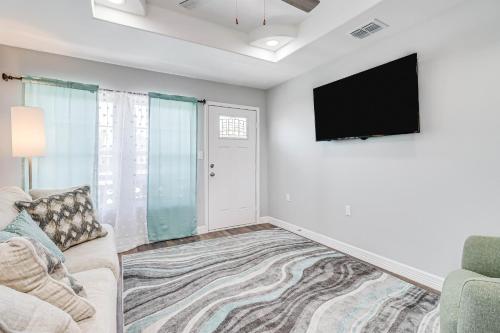 a living room with a couch and a flat screen tv at Ideal Time in Padre Island