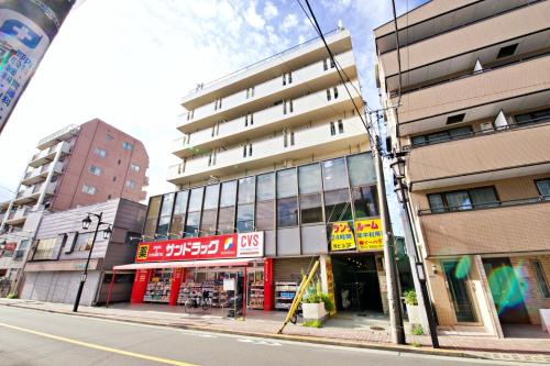 a building on the side of a city street at ダイトービル304 in Tokyo