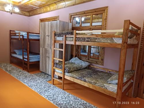 a group of bunk beds in a room at INJIR Hostel in Dushanbe