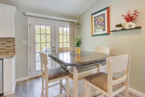 a dining room with a wooden table and chairs at Pet-Friendly Dayton Home with Grill, Walk to Park! in Dayton