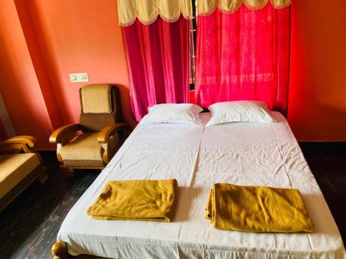 מיטה או מיטות בחדר ב-Gokarna cross stay