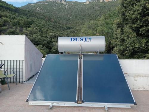 a dust sign on top of a roof at Locanda D'Ogliastra, in Triei