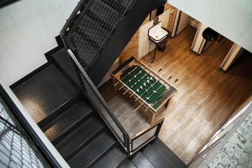 an overhead view of a room with a table and chairs at room00 Chueca Hostel in Madrid