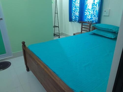 Łóżko lub łóżka w pokoju w obiekcie Dr B Das HomeStay
