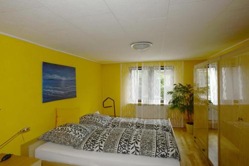 Ένα ή περισσότερα κρεβάτια σε δωμάτιο στο Ferienwohnung Nessler