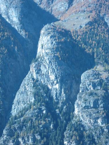 an aerial view of a rocky mountain with trees at Chalet Sven & Marc Grächen, Niedergrächen Vallis in Sankt Niklaus